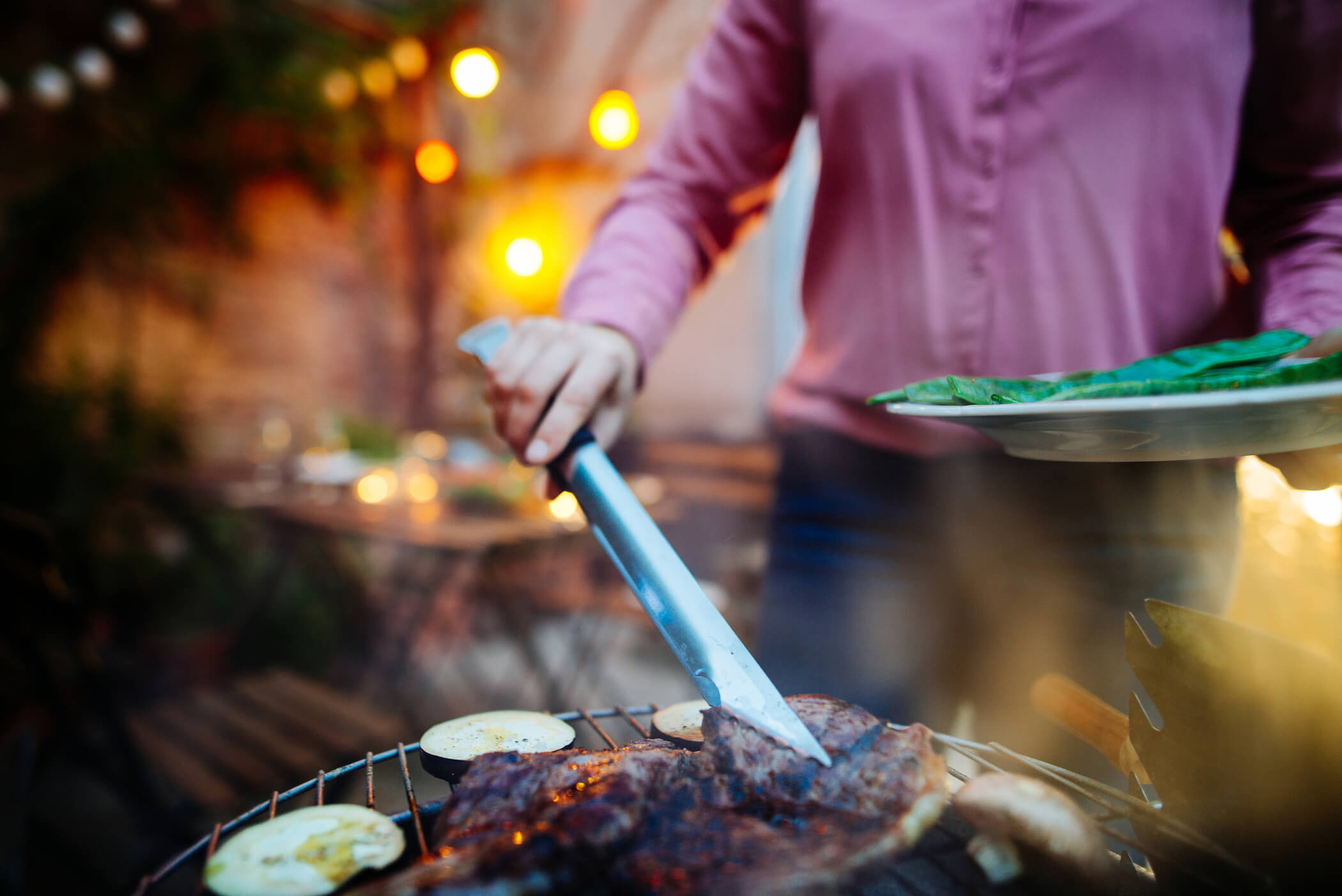 man grilling food outdoorsl